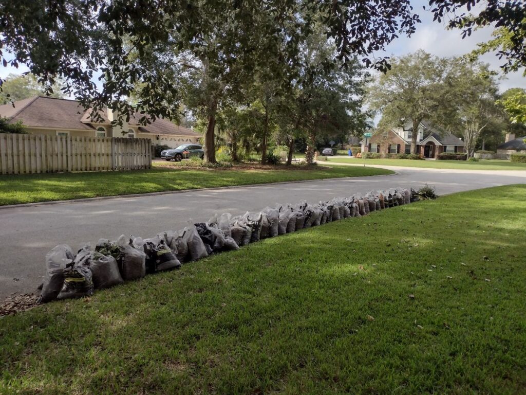 Close up of heavy landscaping bags on a job site during a 13-day grind representing work ethic and discipline.