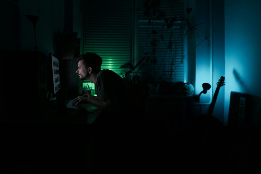creator working late at night building digital distribution and online visibility through consistent content creation