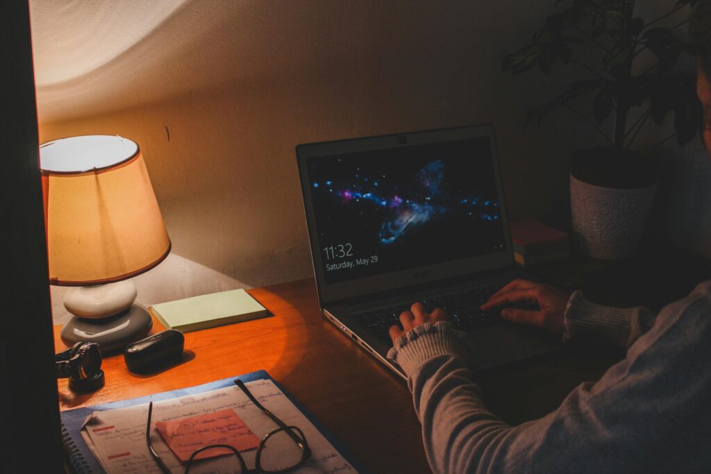 Late night workspace showing how ruthless consistency builds freedom through obsession, learning, and long-term growth