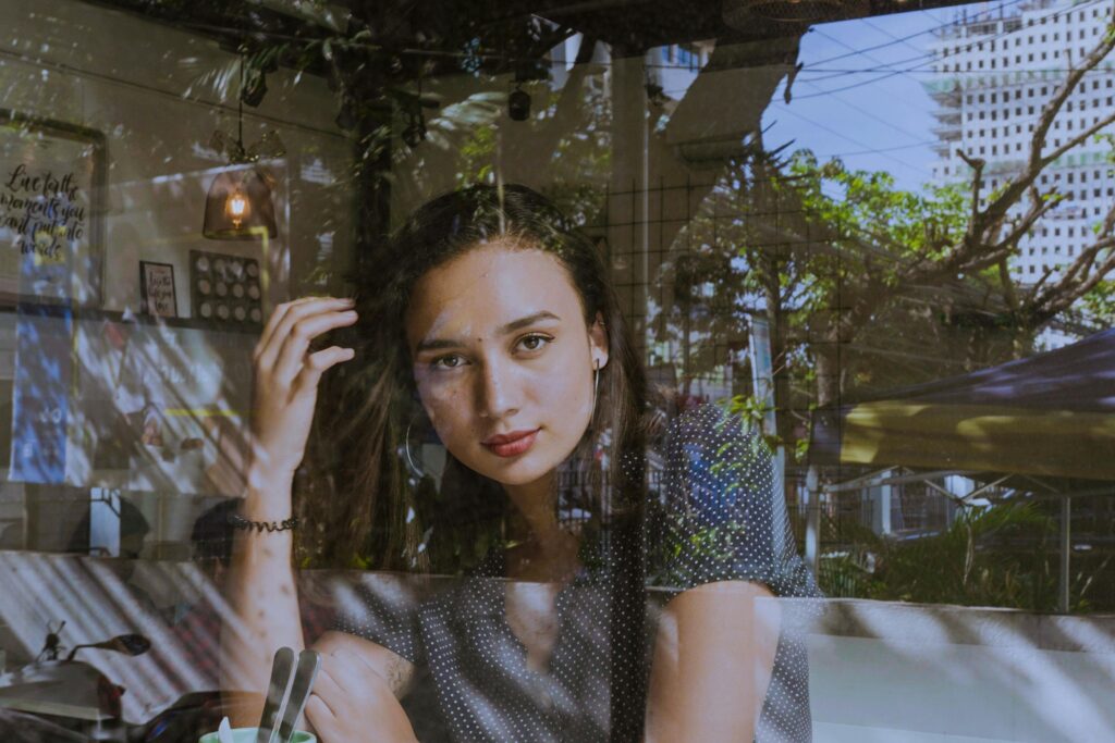 Reflective woman representing how ruthless consistency builds freedom through pain, purpose, resilience, and long-term personal growth