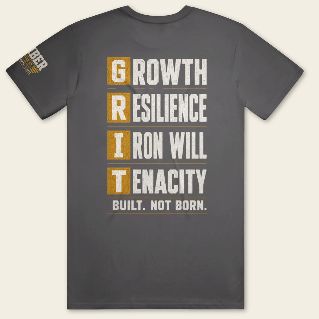 Back view of the BUILD GRIT Premium T-Shirt in Heavy Metal featuring the GRIT acronym design with Growth, Resilience, Iron Will, and Tenacity.