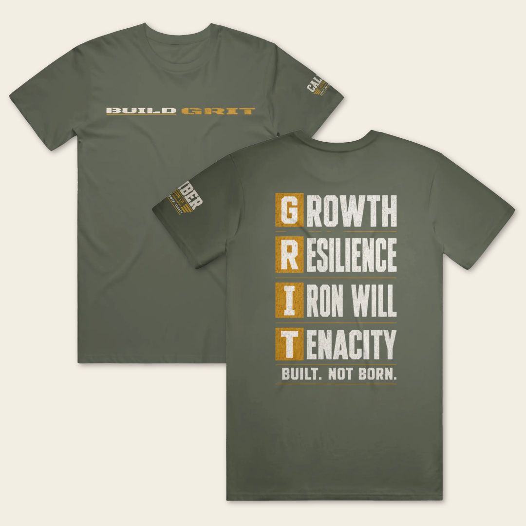 BUILD GRIT Premium T-Shirt in Military Green showing front and back views with distressed graphics and a Caliber Motivation Co. sleeve patch.
