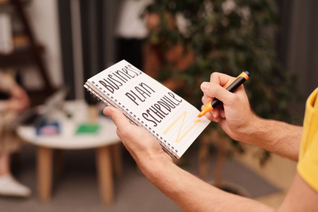 Entrepreneur creating a business action plan after reading the best books for entrepreneurs
