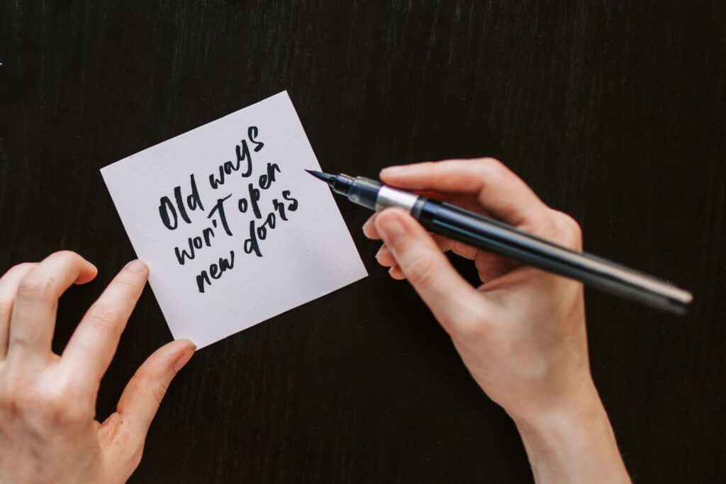 Sticky note reminding readers to change old thinking patterns before replacing "I can't" with a better question.