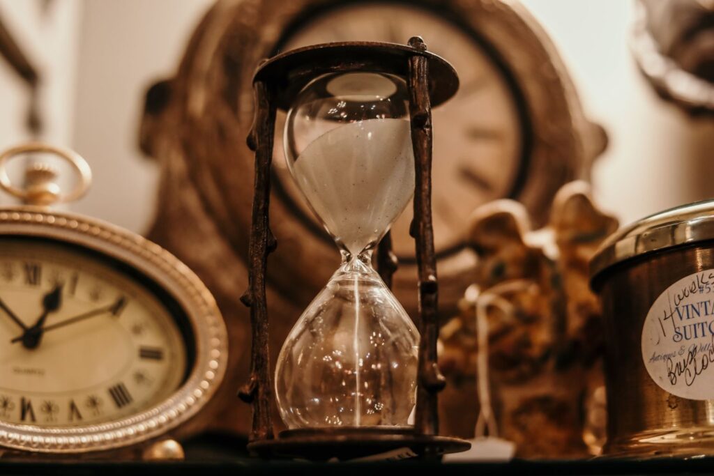 Vintage hourglass representing patience and long-term thinking in Warren Buffett quotes on life and success