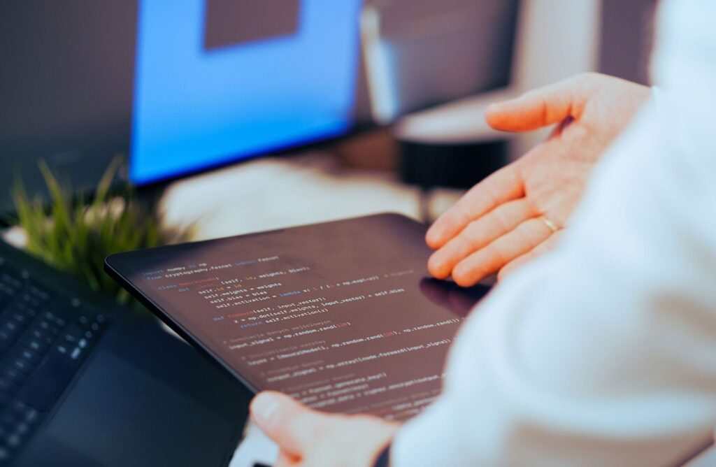 Entrepreneur reviewing AI solutions on a tablet while choosing the right AI platform to improve productivity and business growth