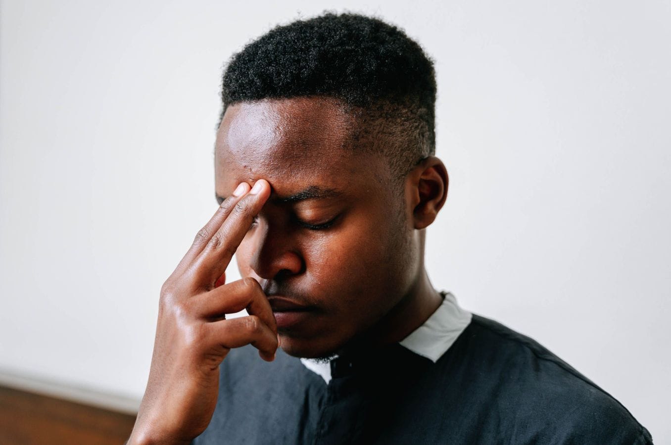 Man pausing to think about how to control your emotions during a stressful moment