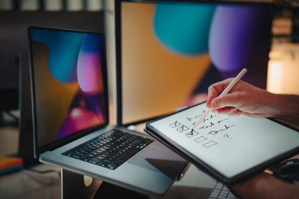 Person checking completed tasks to illustrate accountability and action in The Now Habit approach to procrastination