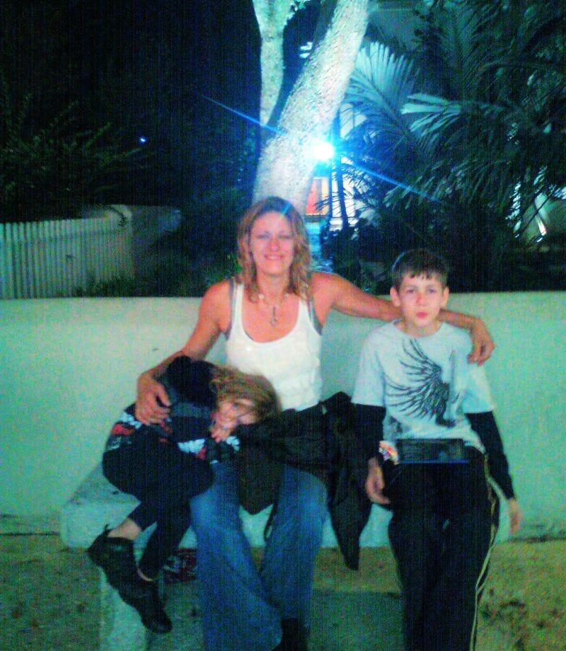 Kelli with her children, part of the family story behind Caliber Motivation Co.