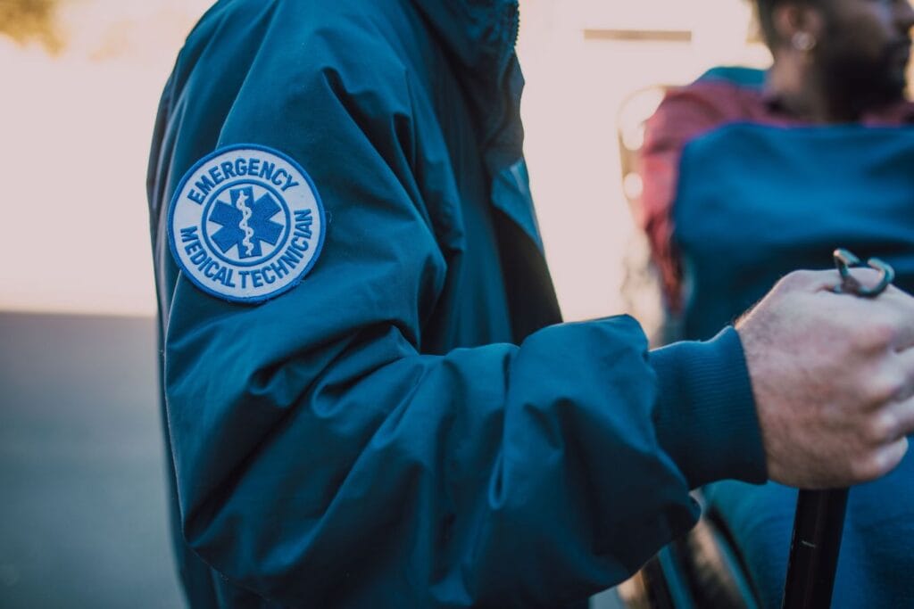 Close-up of an emergency medical technician uniform patch, illustrating the lesser-known EMT work discussed in the David Goggins Success Story.
