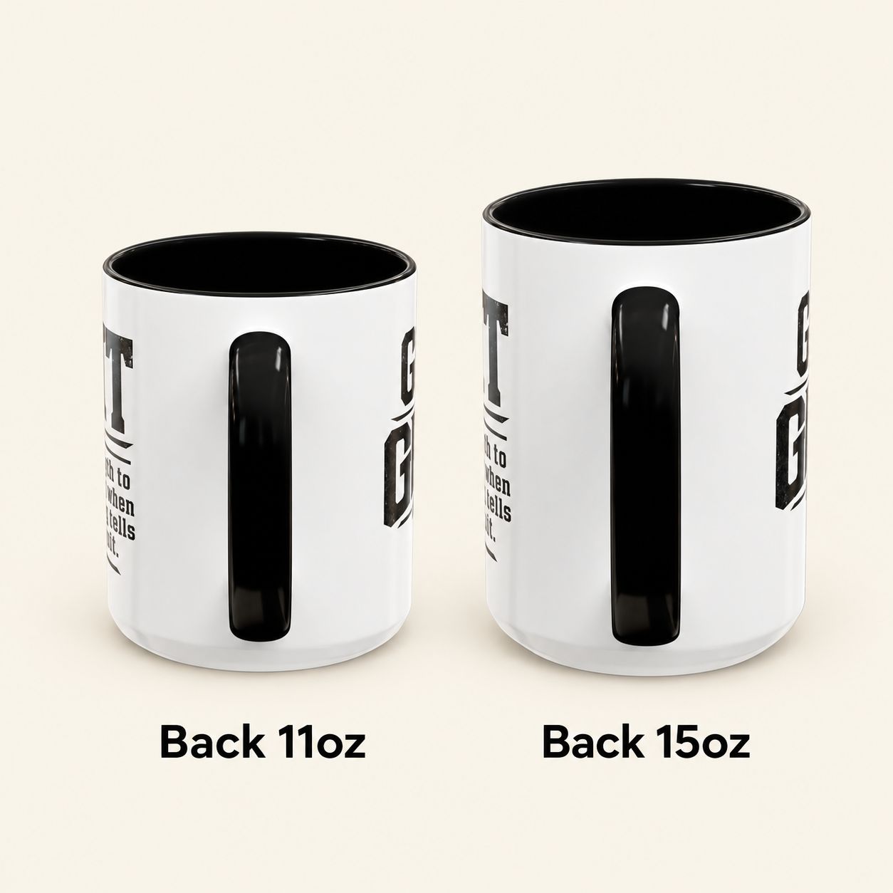 Got Grit Mug rear handle view comparing 11oz and 15oz white ceramic mugs with black handles and interiors.