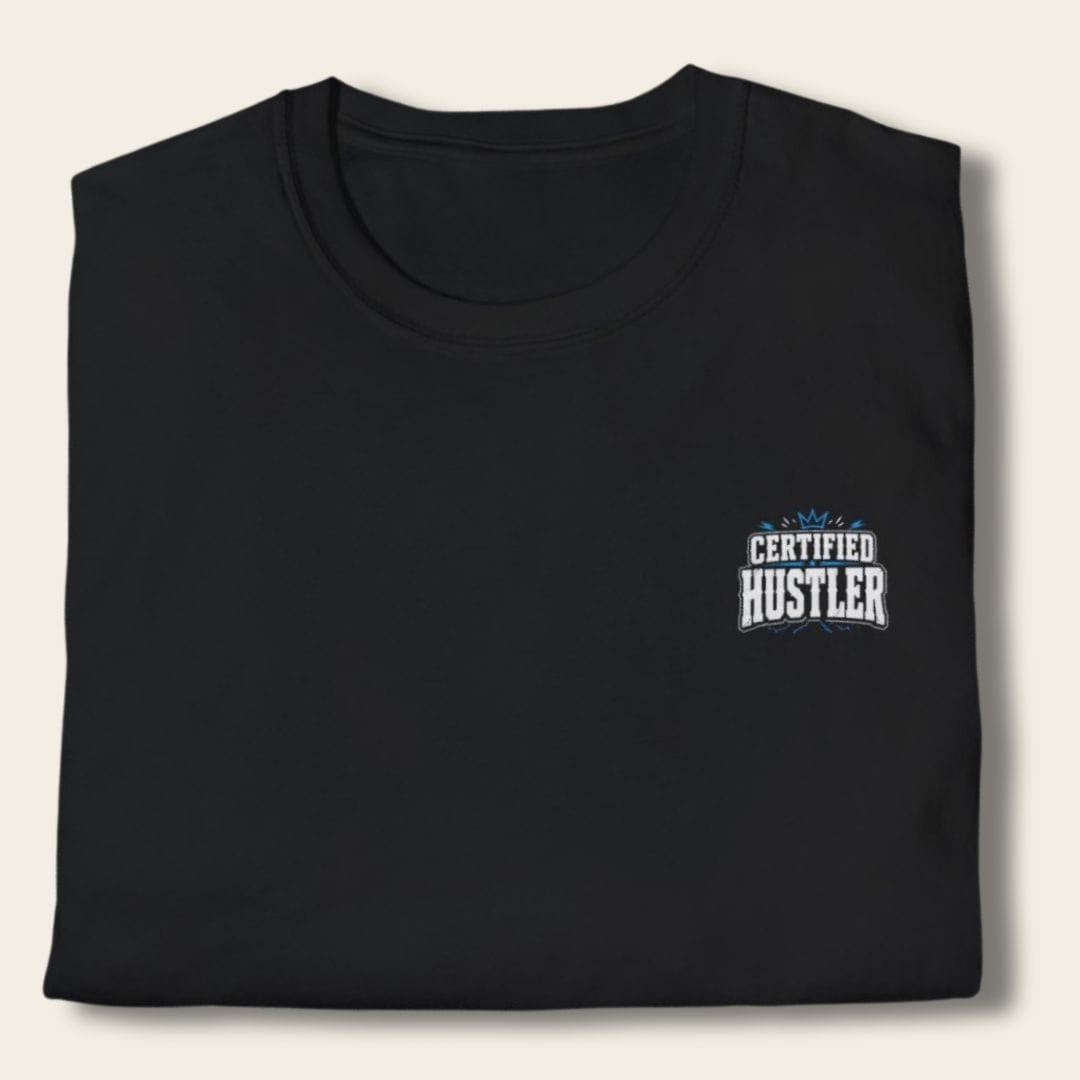 Close-up of the black Wanted Like-Minded Peeps T-Shirt, folded to show the white and electric-blue Certified Hustler left-chest graphic.